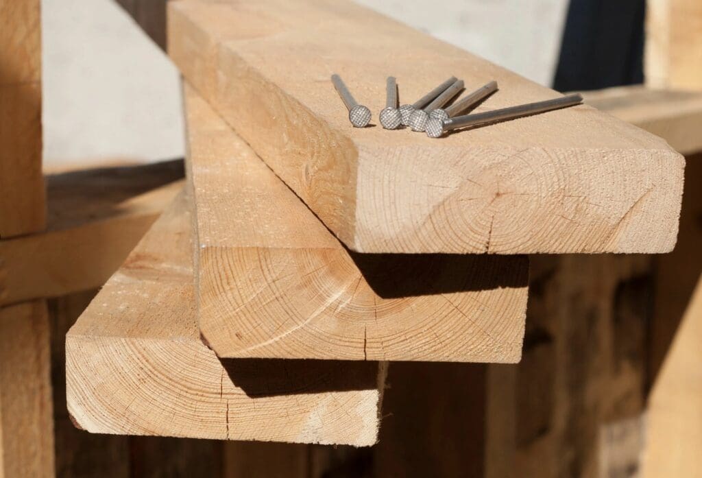 Three wooden blocks and nails